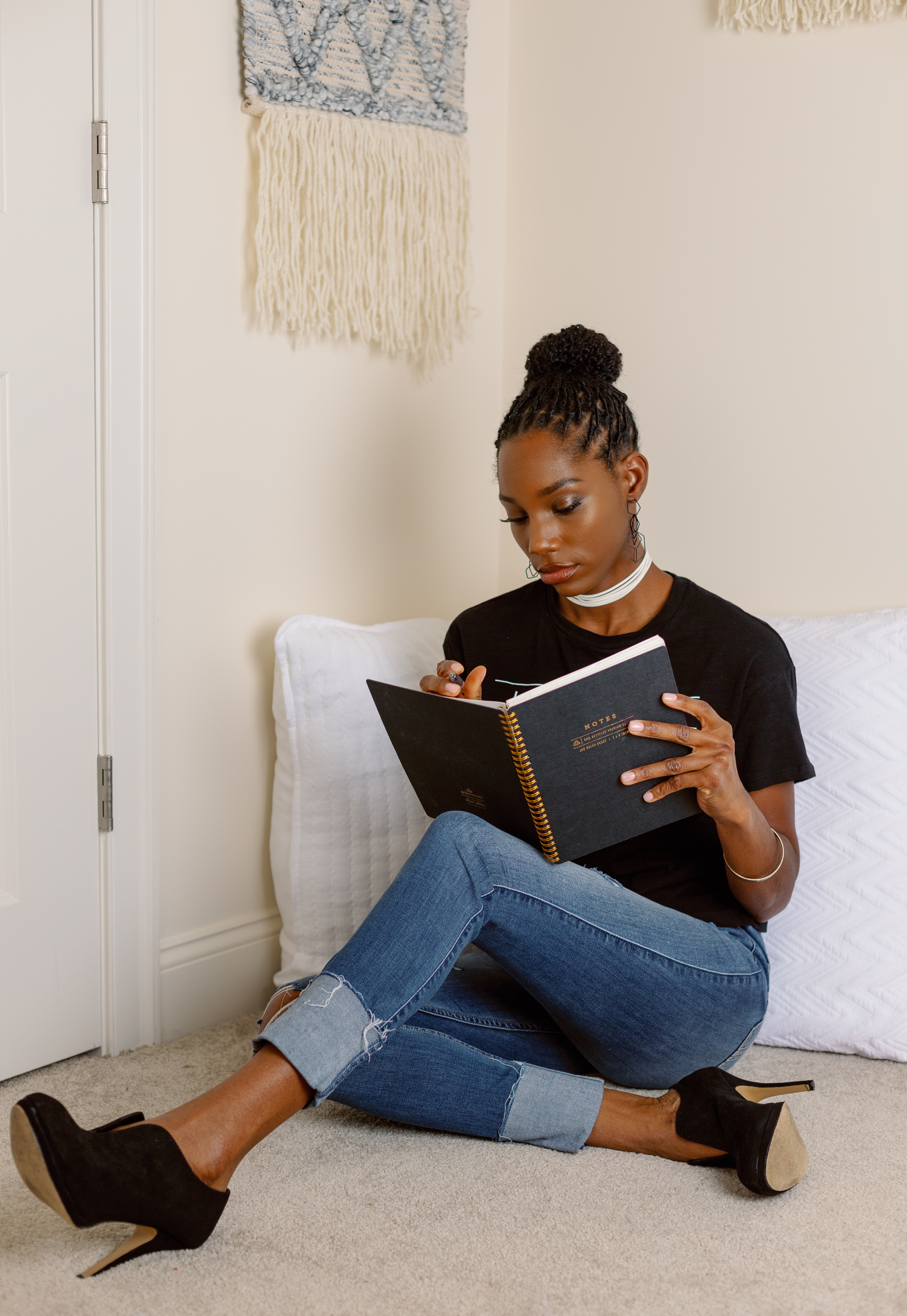 Jovana Scott journaling, reflecting the heart behind breathe.