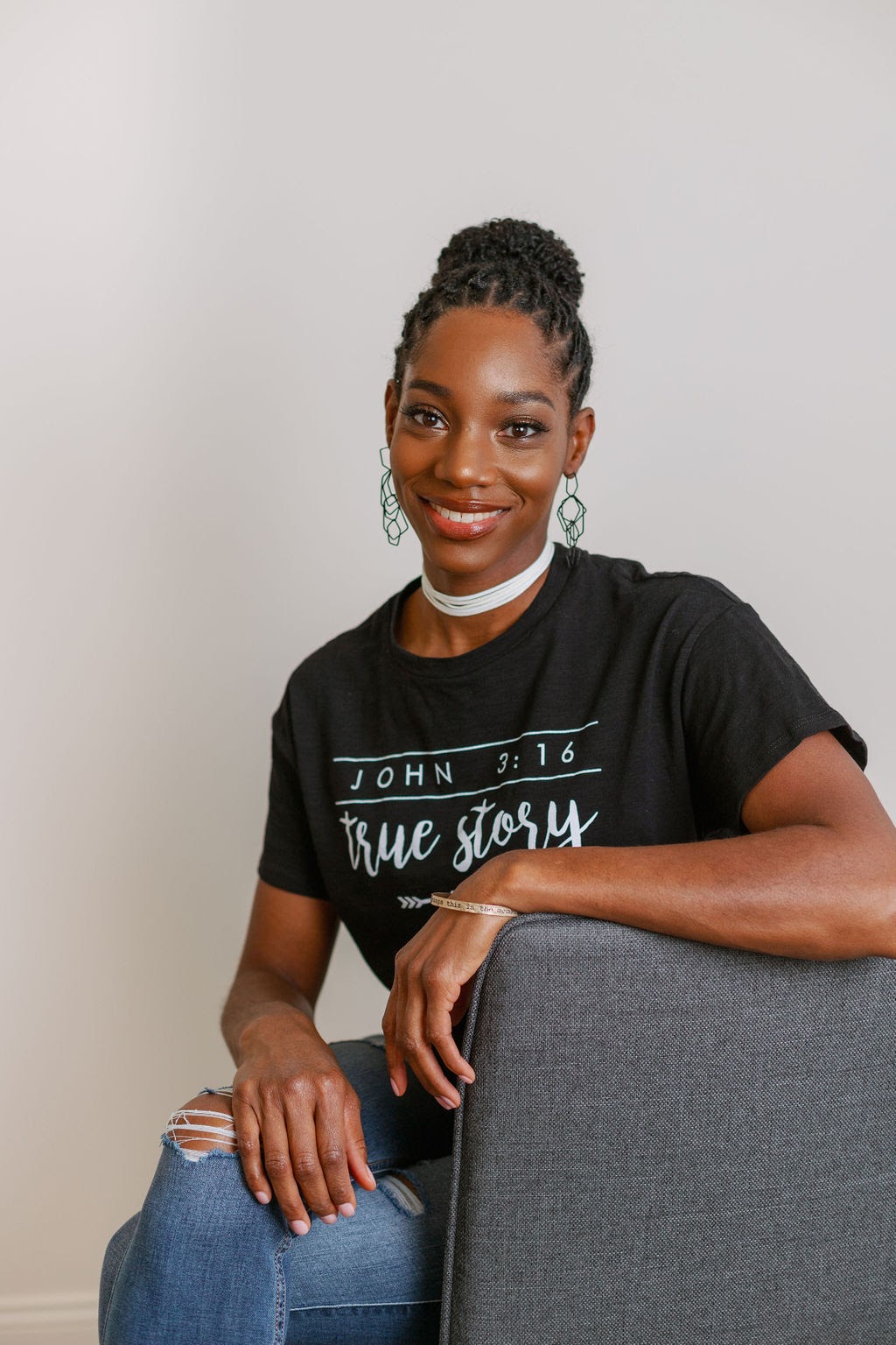 Jovana Scott in a relaxed, thoughtful pose — reflective and grounded