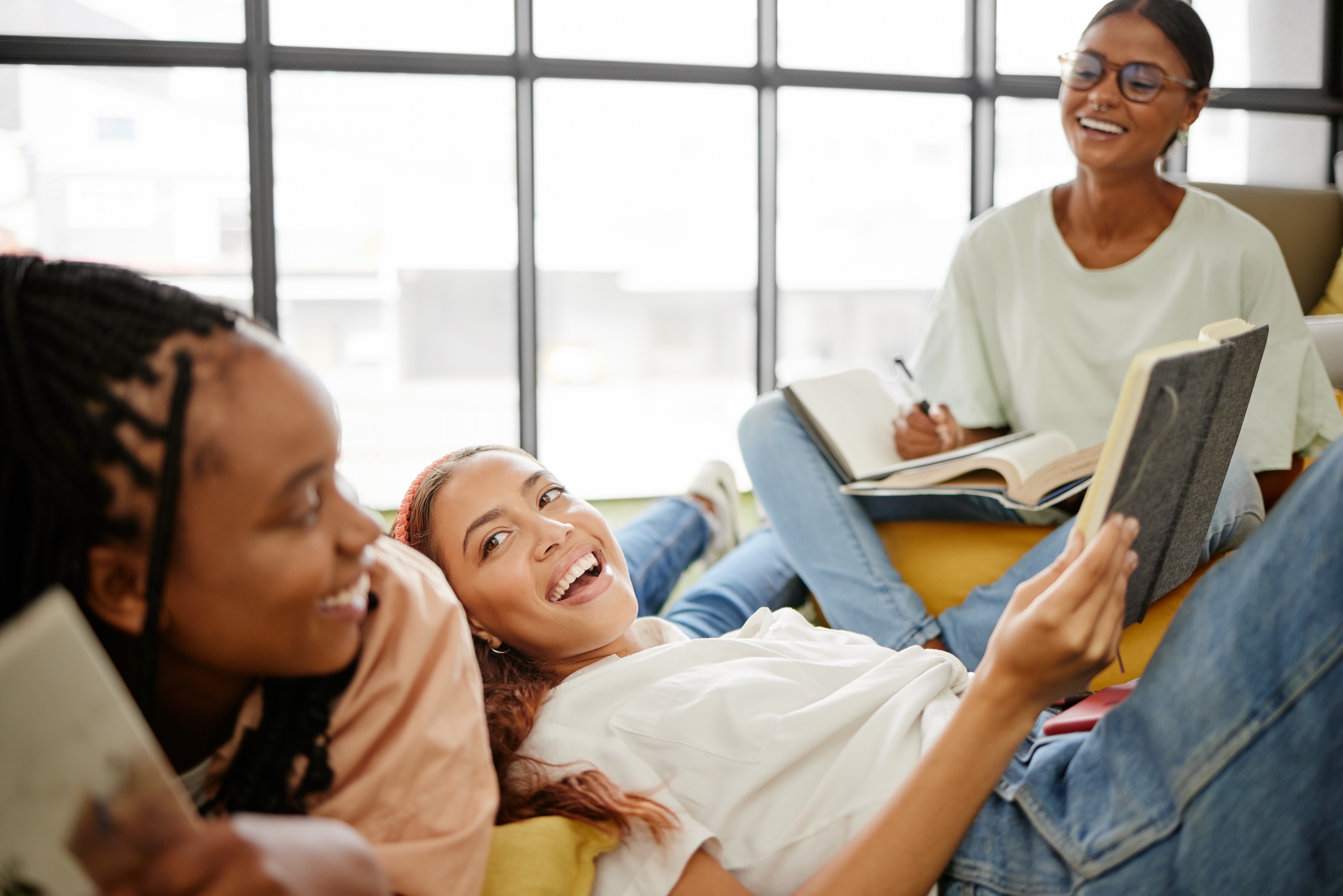 Women journaling together and sharing reflections in an intimate group